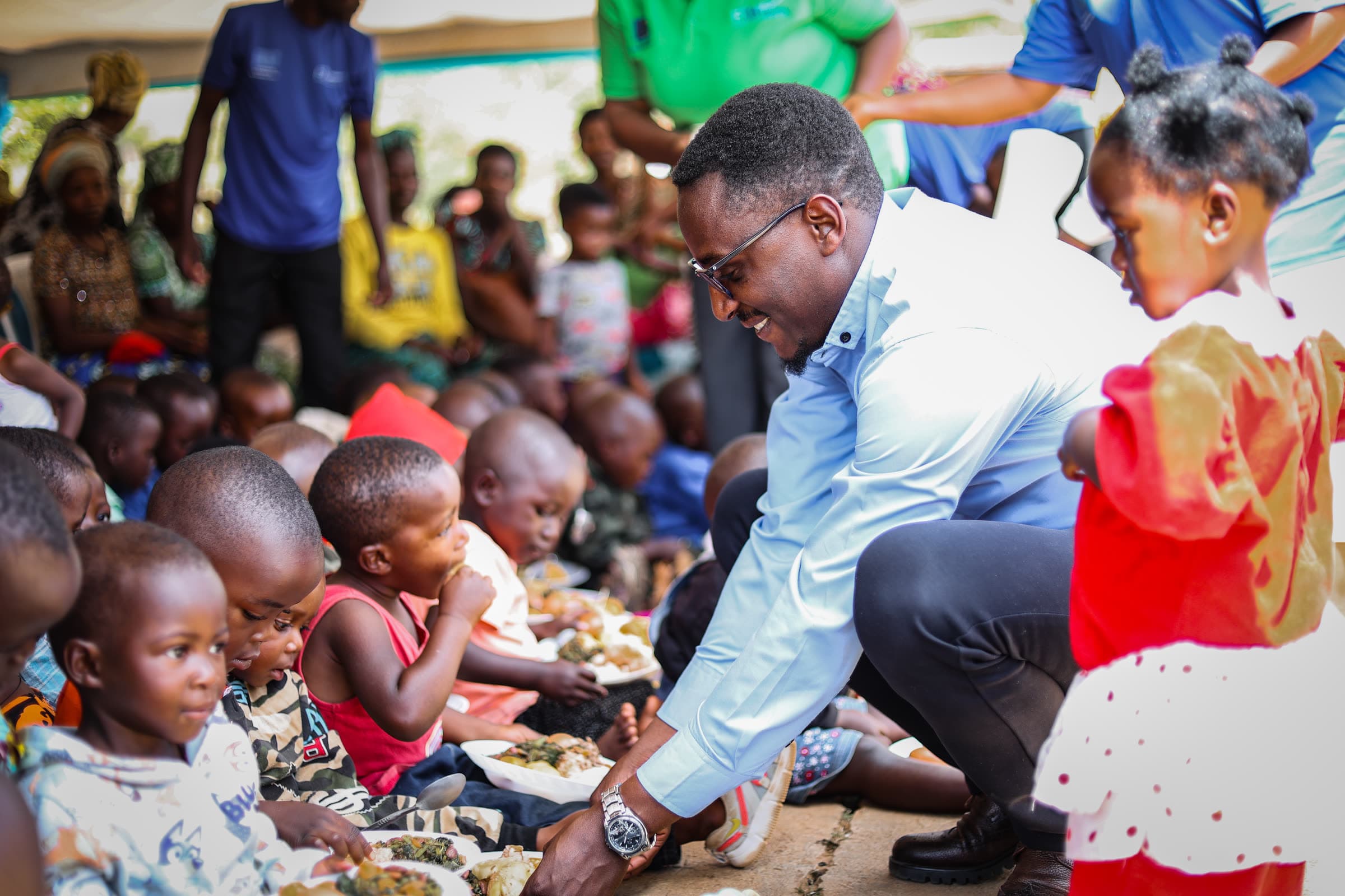 A community nutrition session, with prepared food being served to children